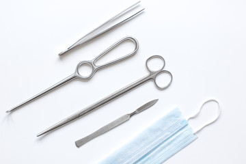 instruments for plastic surgery on white background top view