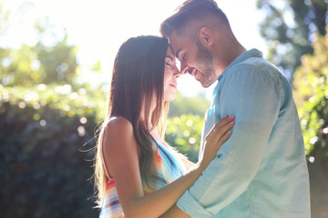 Lovely couple hugging on street