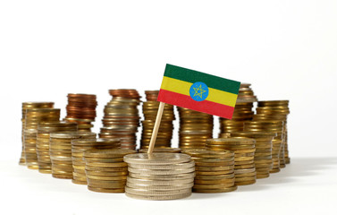 Ethiopia flag waving with stack of money coins