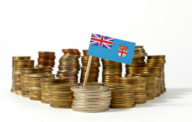 Fiji flag waving with stack of money coins