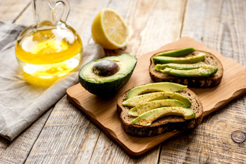 making sandwiches with avocado healthy organic food top view