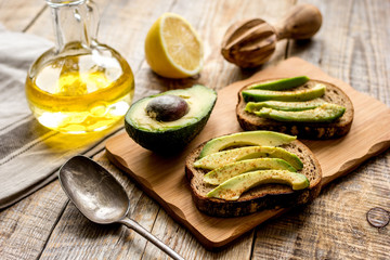 making sandwiches with avocado healthy organic food top view