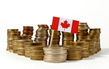 Canada flag waving with stack of money coins