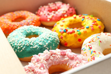 Delicious donuts in box, closeup