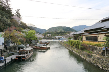 Fototapeta na wymiar A view of Arashiyama from above the bridge