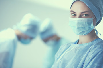 Team surgeon at work in operating room.