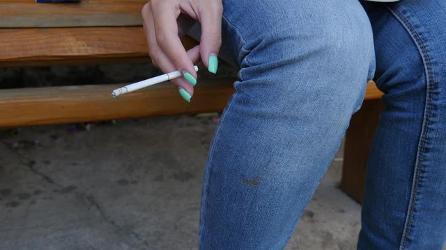 Female Hand With A Cigarette