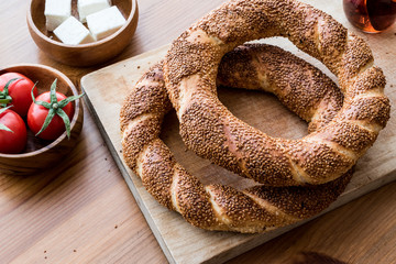 Turkish Bagel Simit with tea, cheese and cherry tomatoes.