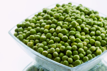Green peas in glass bowl