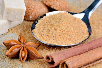 Silver spoon with different types of sugar