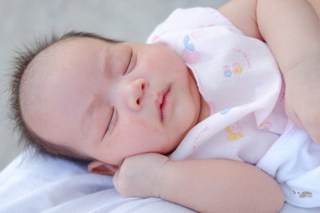 Newborn Asian baby girl sleeping