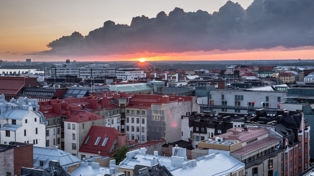 Helsinki rooftops at Sunset with dark clouds. Aerial view of Design District Helsinki, Finland.
