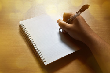 Writing on notebook