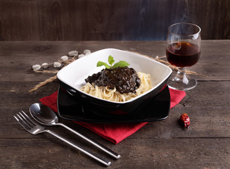 linguine pasta dish with squid with chili black
