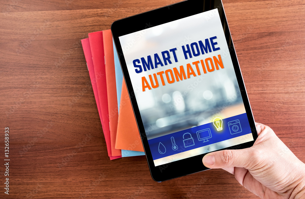 Poster top view of hand holding tablet with smart home automation word