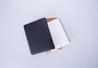 diary or open leather notebook on the background.
