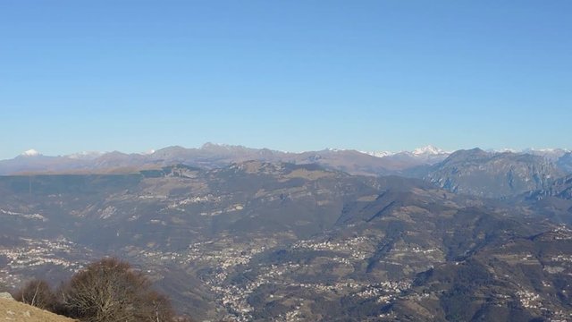 Great landscape with fantastic blue sky on the Orobie Alps and Padana plain a dry winter season without snow. Panorama from Linzone Mountain, Bergamo, Italy. 