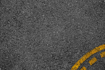 Fototapeta premium Asphalt background texture with some fine grain with Yellow Stri