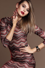 Fashion portrait of young elegant woman in studio.