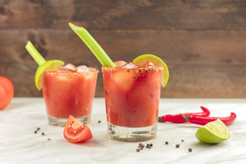 Bloody Mary cocktails with celery and lime