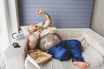 Man eating unhealthy food