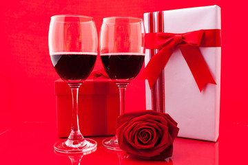 St Valentine's setting with present and red wine