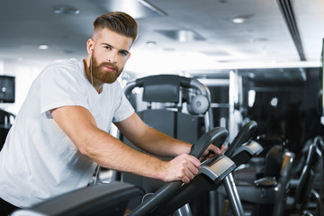 Sporty bearded man in gym