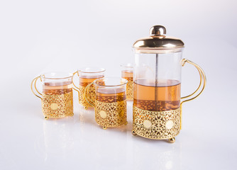 tea set or tea set with tea on background.