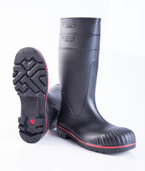 shoe or black color rubber boots on a background.