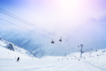 Fototapeta na wymiar Ski slope and cable car on the ski resort