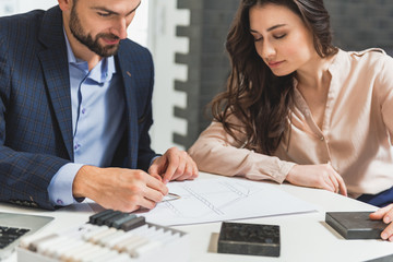 Man is presenting his ideas about design of interior