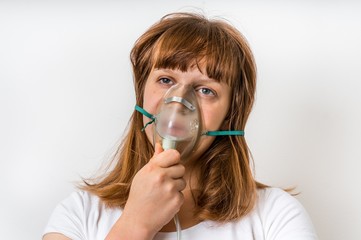 Diseased female patient with oxygen mask