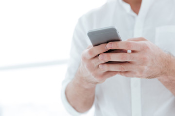 Cropped picture of man chatting by phone