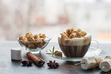 Glass of coffee with popcorn