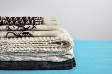 Wool socks on a wooden blue background.
