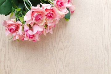 Bouquet Pink rose on wooden background and copy space. Valentine concept. Soft focus.