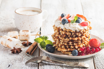 Belgian waffles with creem and berries