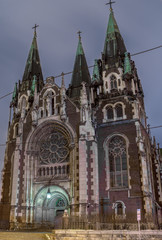Fototapeta na wymiar Ancient monument - facade of Gothic church in evening