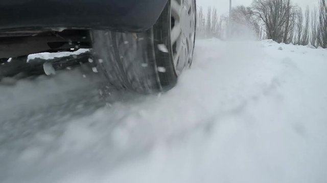 Car tire on the winter road
