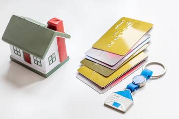 credit cards concept mortgag for new home on white background