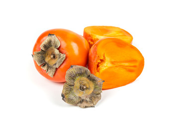 One whole one cut persimmmon isolated on a white background