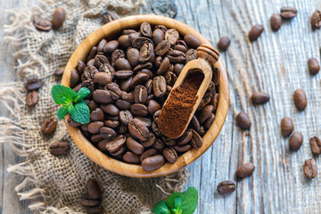 Grains and ground coffee in a wooden bowl.
