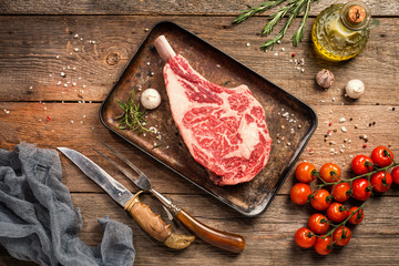 Raw tomahawk beef steak