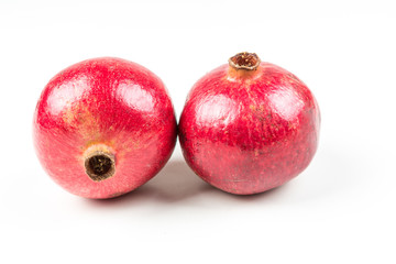Whole ripe pomegranates isolated on a white background