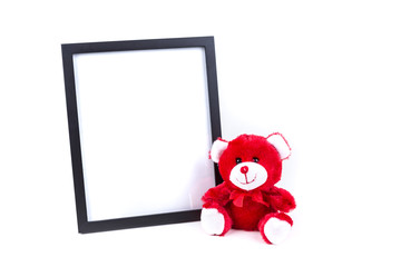 Valentine bear with a black picture frame isolated on a white background