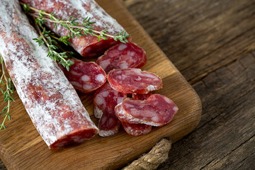 Typical traditional spanish salamis on wooden surface