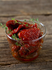 sun dried tomatoes on wooden surface
