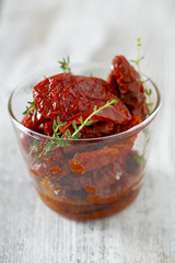 sun dried tomatoes on wooden surface