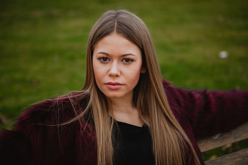 Fototapeta premium Pretty blonde girl with fur coat