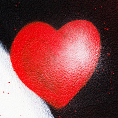 Urban red heart painted on wall, symbol